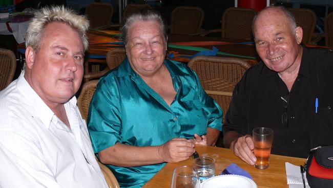 John and Suzy Watson congratulate Cam Schroder (left) on his 50th birthday. Photo Lyn Stephens/Capricorn Coast Mirror.