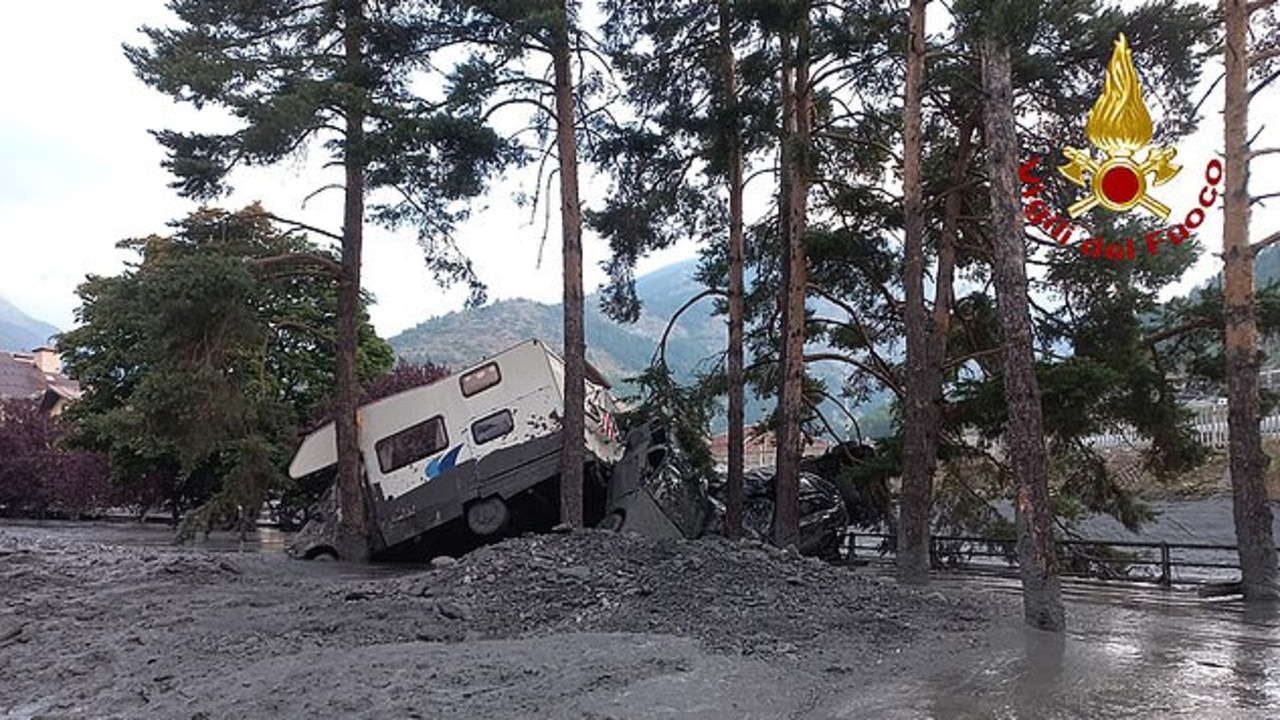 Firefighters said they rescued six people from an upturned caravan that was swept away. Picture: Vigili del Fuoco.