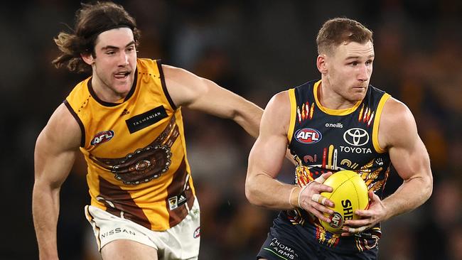 Hawk Jai Newcombe chases Adelaide midfielder Rory Laird last season. Picture: Michael Klein