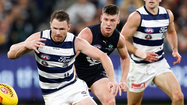 MELBOURNE, AUSTRALIA - APRIL 27: Patrick Dangerfield of the Cats and Sam Walsh of the Blues in action during the 2024 AFL Round 07 match between the Geelong Cats and the Carlton Blues at the Melbourne Cricket Ground on April 27, 2024 in Melbourne, Australia. (Photo by Michael Willson/AFL Photos via Getty Images)