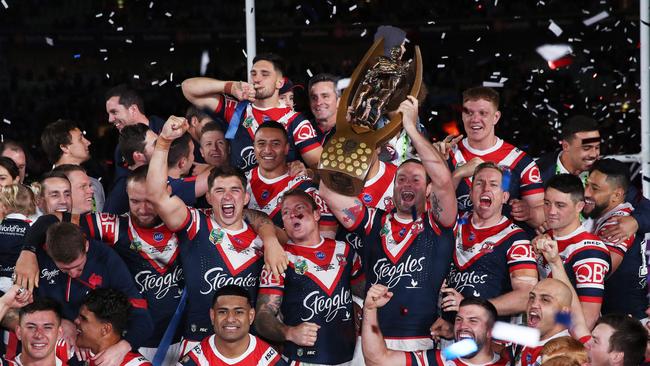 The Sydney Roosters celebrate with the Provan-Summons Trophy after defeating the Melbourne Storm in the 2018 NRL Grand Final at ANZ Stadium. Picture. Phil Hillyard