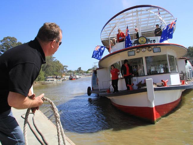 Captain Chris Pointon gets ready to throw his boat the PS Melbourne a mooring rope at the Centenary celebrations on the Mildura riverfront.