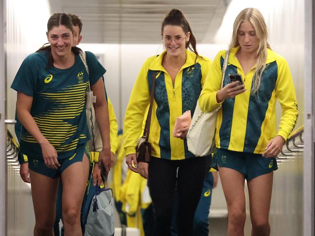 Queensland Olympians including Meg Harris and Kaylee McKeown arrive in Brisbane on Wednesday. Picture: Liam Kidston