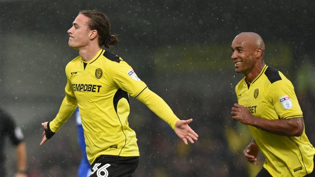 Jackson Irvine (L).