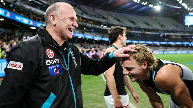 MELBOURNE, AUSTRALIA - JUNE 09: Ken Hinkley, Senior Coach of the Power celebrates with Miles Bergman of the Power during the 2023 AFL Round 13 match between the Western Bulldogs and the Port Adelaide Power at Marvel Stadium on June 9, 2023 in Melbourne, Australia. (Photo by Dylan Burns/AFL Photos via Getty Images)