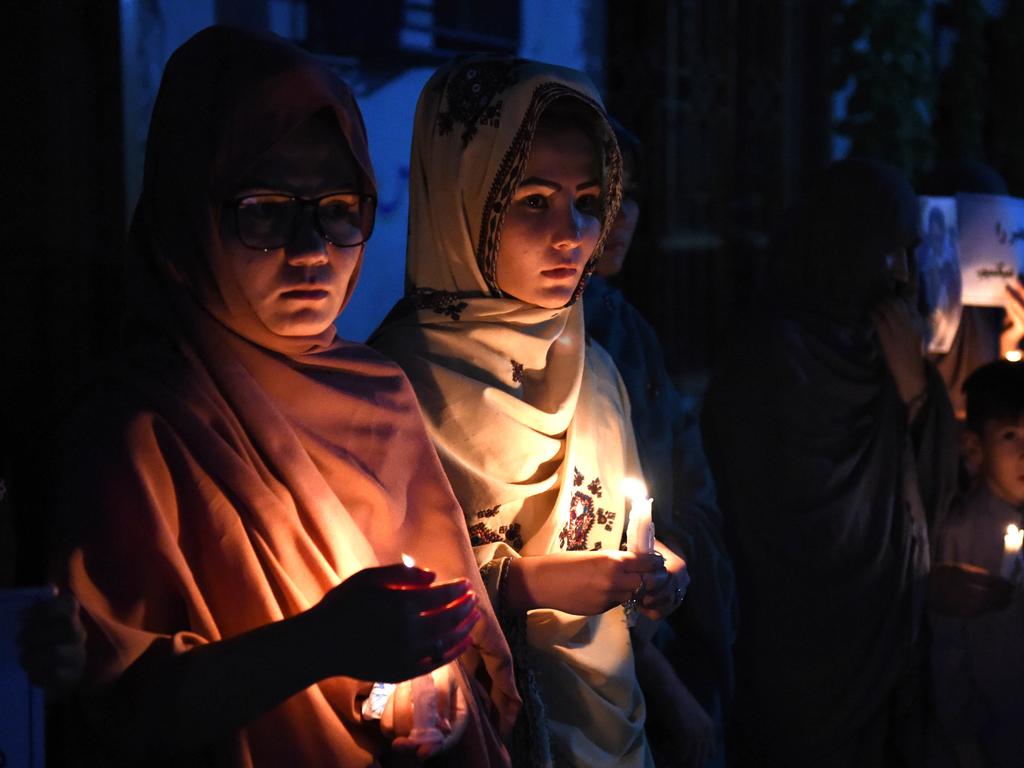 Pakistani women of the Hazara community light candles during a tribute ceremony in Quetta on July 24, 2016, a day after twin bombings tore through crowds of Shiite Hazara protesters in Afghanistan. Kabul was plunged into mourning July 24, 2016 after its deadliest attack for 15 years killed 80 people and left hundreds maimed, reigniting concern that the Islamic State group was seeking to expand its foothold in Afghanistan. The attack in the majority Sunni country highlighted the risk of sectarian disharmony in a nation that has largely avoided the bloody strife between Sunnis and Shiites that plagues much of the Muslim world. Picture: AFP PHOTO / BANARAS KHAN