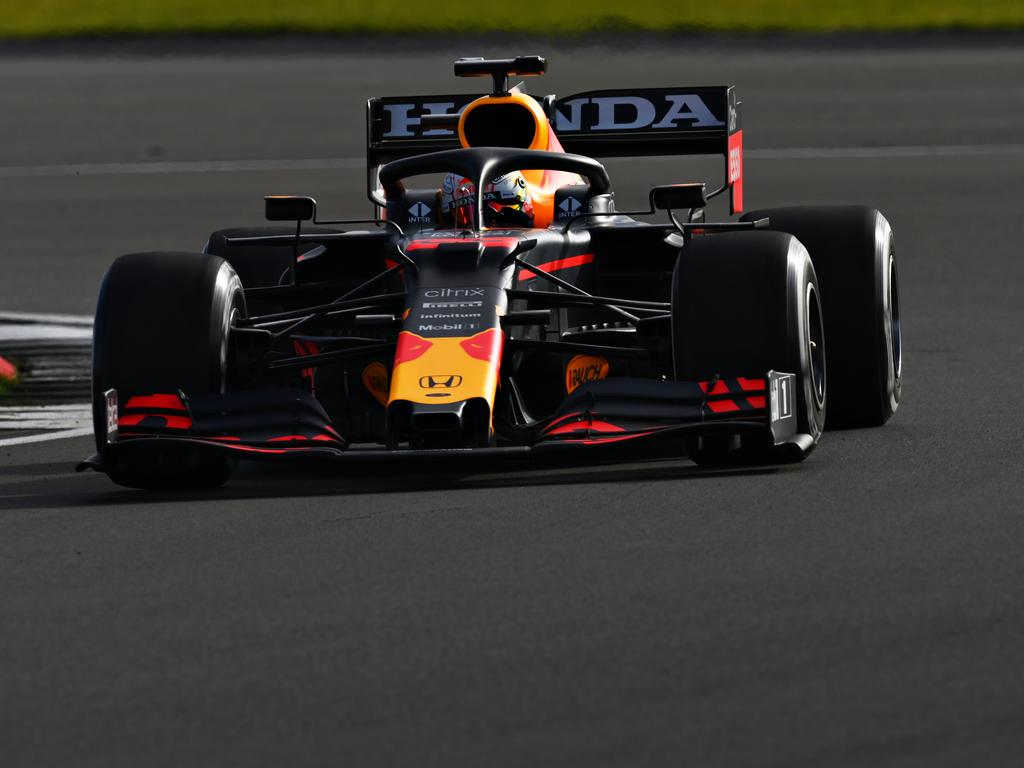 Max Verstappen also driving the old car.