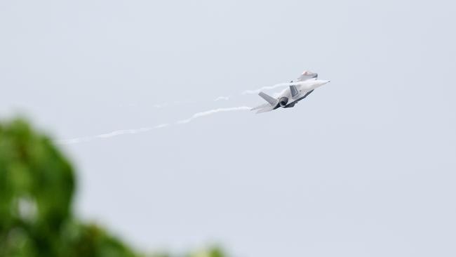 The Royal Australian Air Force has flown a Lockheed Martin F-35 Lightning II strike fighter jet to Cairns, the first time one of the air force's fifth generation fighter jets has visited Far North Queensland. Wing Commander Phil Eldridge executes a low pass flyover with the F-35 Lightning II over the Cairns Esplanade. Picture: Brendan Radke