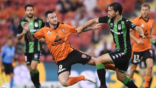 Brisbane Roar’s Roy O’Donovan (left) and Western United’s Dario Jertec collide on Friday night. Picture: Getty Images