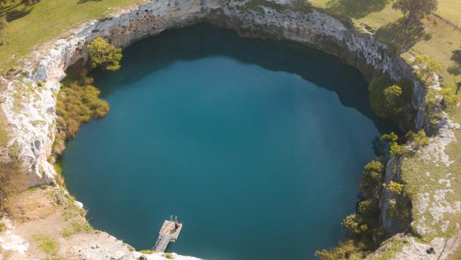 4/7Little Blue Lake, The Limestone CoastFifteen minutes out of Mount Gambier, the impressive swimming amphitheatre of Little Blue Lake is surrounded by sheer 10-metre limestone walls and boasts crystal-clear fresh water.