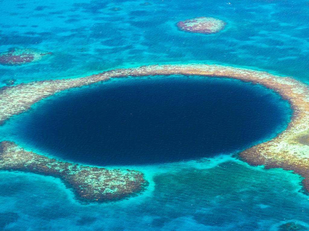 Aerial View to the famous diving site and natural phenomenon the Blue Hole in the Lighthouse Reef, East of the Turneffe Atoll in Caribbean Sea, Belize, Central America.  Picture: istock