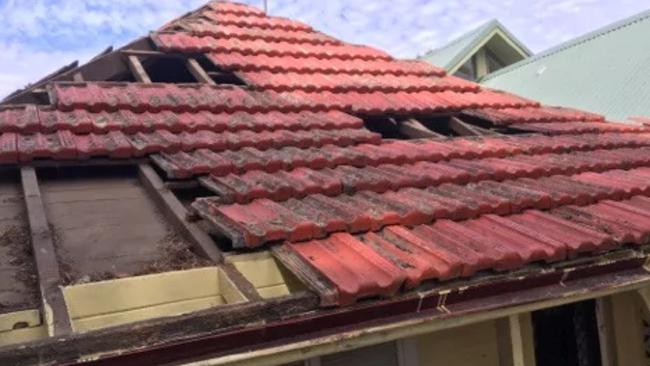 Burwood police have charged two men over a roof repair scam.