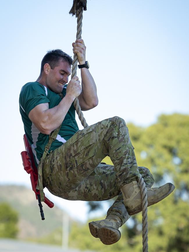 An Australian Army officer from 2nd Cavalry Regiment conducts a rope climb as part of the annual 3rd Brigade Fitness competition at Lavarack Barracks, Townsville, Queensland. PHOTO: CPL Jack Pearce