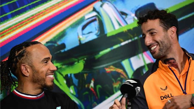 Mercedes' British driver Lewis Hamilton (L) and McLaren's Australian driver Daniel Ricciardo