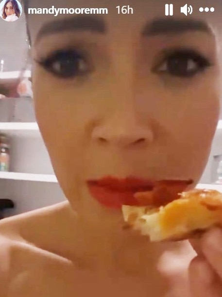 She admitted she was “naked” while she ate pizza. Picture: mandymoore/Instagram