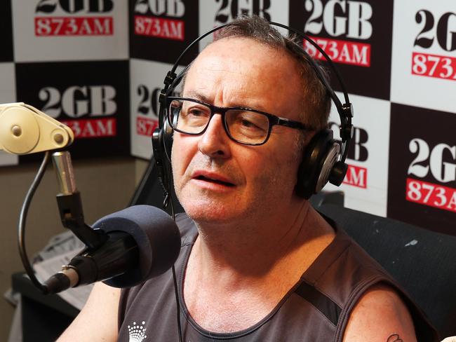 Chris Smith receives a tattoo of a Bunny from Tony Cohen on air during his 2GB radio show at Pyrmont. Picture Craig Greenhill