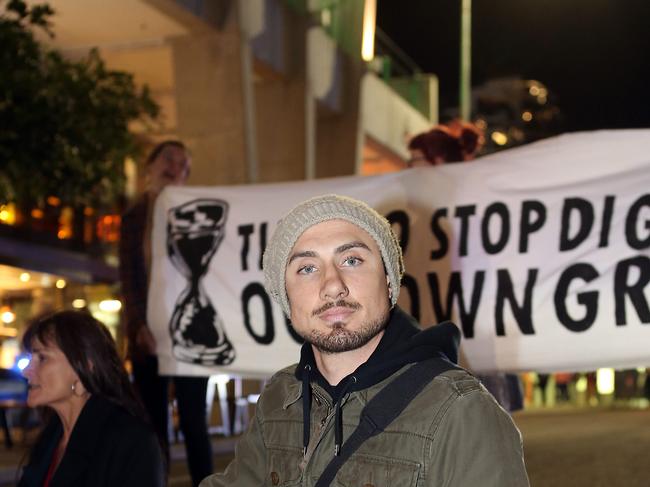 Daniel Heggie was one of those who glued themselves to the road. Picture: Richard Gosling/AAP