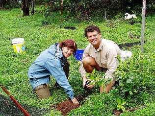 DECCW senior threatened species officer Dianne Brown with Northern Rivers CMA catchment officer, John Nagle, planting out the endangered Coastal Fontainea plants grown from genetically selected plant material.