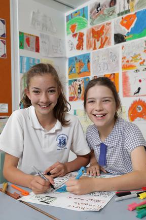 Seaforth public school Year 6 students (L-R) Angie Procter and Josie Lear pictured at Seaforth public school with drawings they made for the Bradfield Sydney buildings competition. Seaforth, Sydney. 14th November, 2019. Picture by Damian Shaw