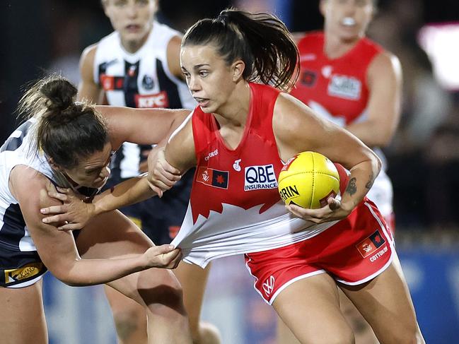 Chloe Molloy of the Swans fends off Muireann Atkinson of the Magpies during the Round 1 AFLW match between the Sydney Swans and Collingwood Magpies at North Sydney Oval on August 30, 2024.. Photo by Phil Hillyard(Image Supplied for Editorial Use only - **NO ON SALES** - Â©Phil Hillyard )