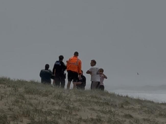 First responders searching for lost swimmers at Surfers Paradise.