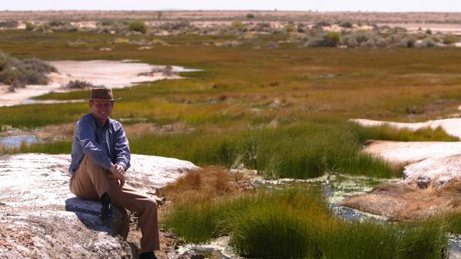 Premier Mike Rann inspects the Bubbler mound spring at Coward Springs, 2005. Picture: James Elsby