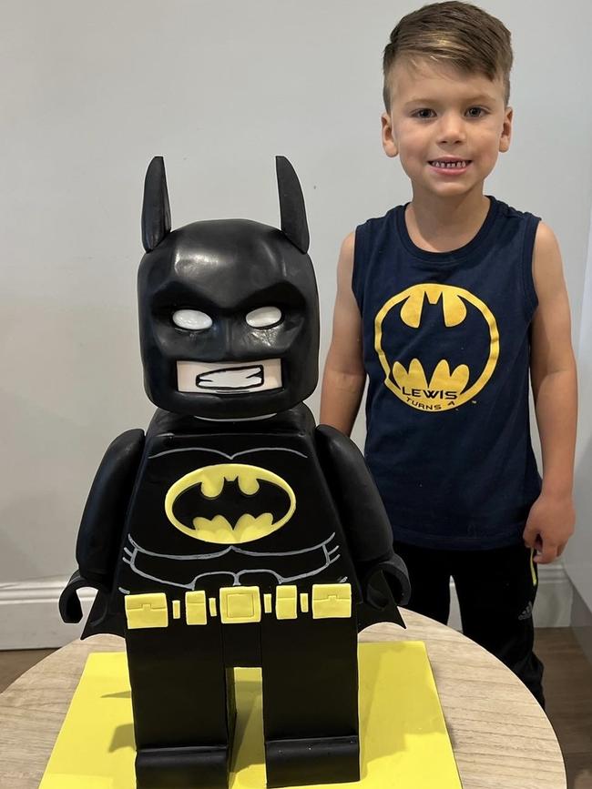 How Sweet It Is owner Stephen McNeill’s son, Lewis, with his 3D Batman cake.