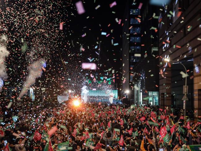 TAIPEI, TAIWAN - JANUARY 13: Confetti flies over the stage and crowd as Taiwan's Vice President and presidential-elect from the Democratic Progressive Party (DPP) Lai Ching-te and his running mate Hsiao Bi-khim speak to supporters at a rally at the party's headquarters on January 13, 2024 in Taipei, Taiwan. Taiwan voted in a general election on Jan. 13 that will have direct implications for cross-strait relations. (Photo by Annice Lyn/Getty Images)