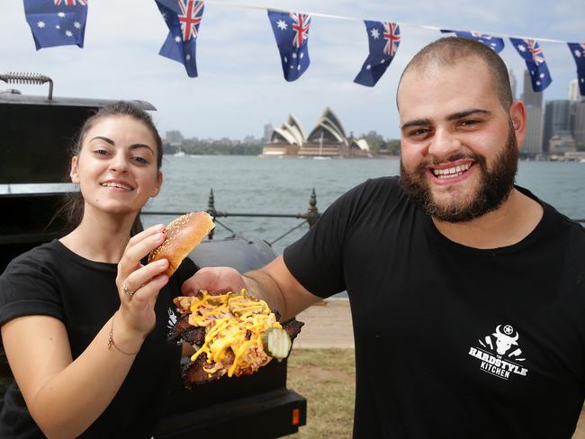 John-Ray Boukarim and Natasha Katsaniotis from the Harstyle kitchen getting ready for the BBQ by the Bridge on Australia Day. Picture: Martin Lange