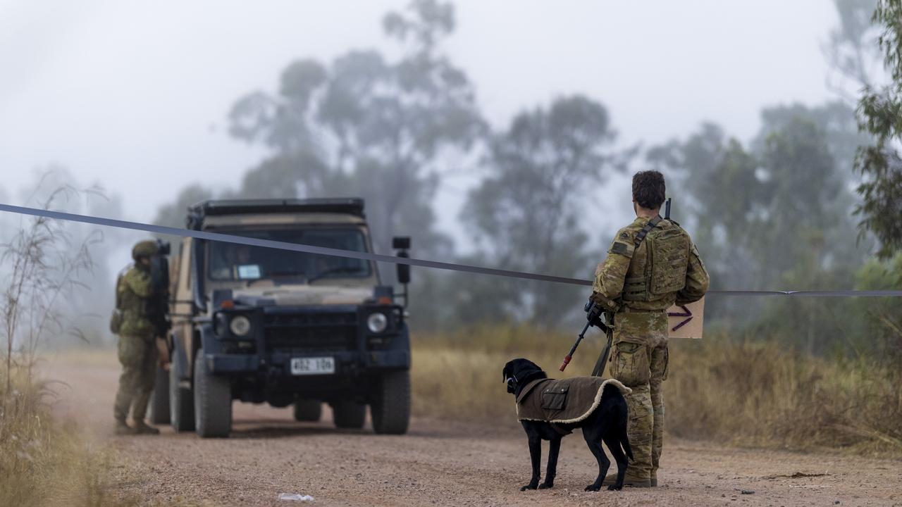 Australian Army soldier Sapper Aidan Jones and his Explosive Detection Dog, Yambo, during Exercise Brolga Run 2024 in Townsville Field Training Area, Queensland.