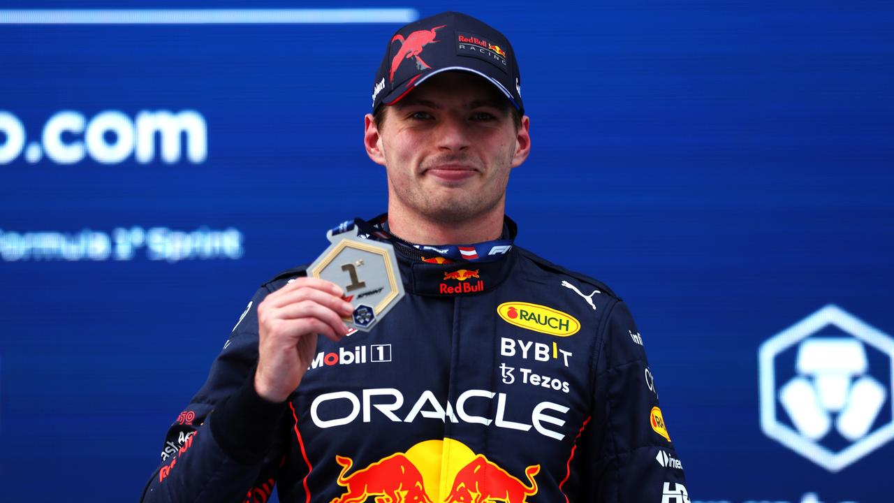 SPIELBERG, AUSTRIA - JULY 09: Sprint winner Max Verstappen of the Netherlands and Oracle Red Bull Racing celebrates with his medal during the F1 Grand Prix of Austria Sprint at Red Bull Ring on July 09, 2022 in Spielberg, Austria. (Photo by Bryn Lennon/Getty Images)