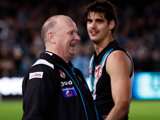 ADELAIDE, AUSTRALIA - SEPTEMBER 13: Ken Hinkley, Senior Coach of the Power exchanges words with Hawthorn players after the 2024 AFL Second Semi Final match between the Port Adelaide Power and the Hawthorn Hawks at Adelaide Oval on September 13, 2024 in Adelaide, Australia. (Photo by Michael Willson/AFL Photos via Getty Images)