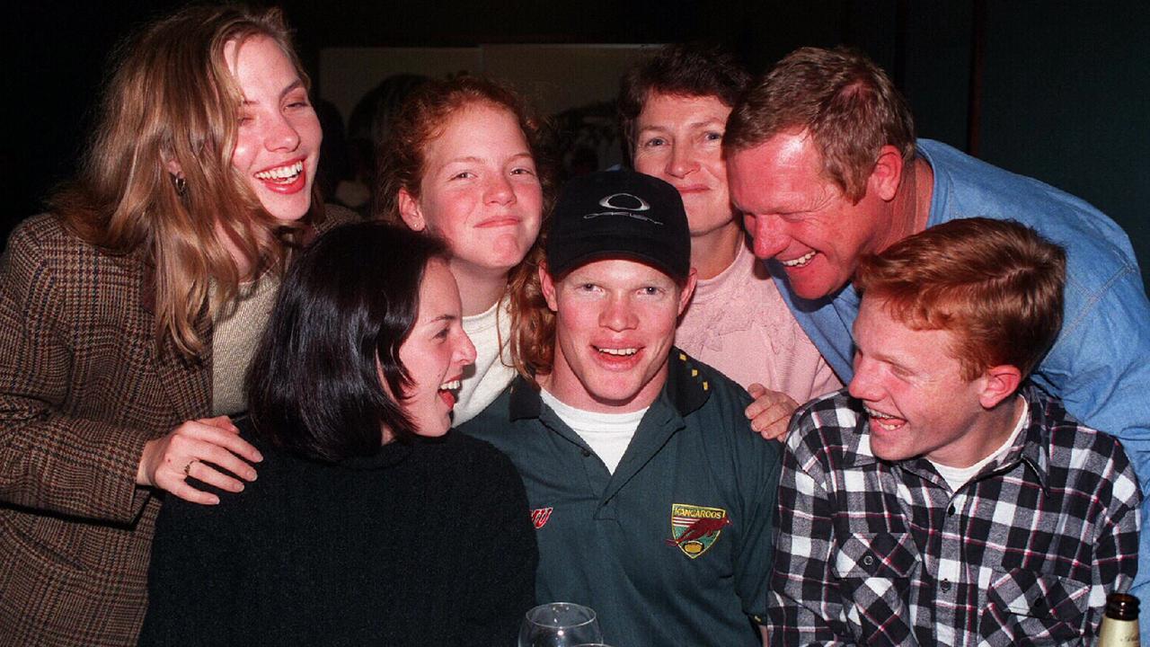 Brett Dallas (C) celebrating with family members.