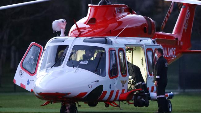 The Air Ambulance lands on the oval at Jan Juc to assist a boy injured in a bike accident. Picture: Alison Wynd