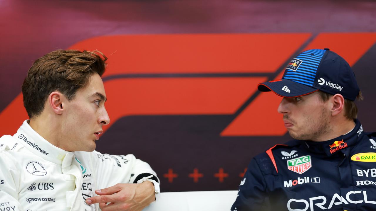 LUSAIL CITY, QATAR - NOVEMBER 30: Pole position qualifier Max Verstappen of the Netherlands and Oracle Red Bull Racing and Second placed qualifier George Russell of Great Britain and Mercedes attend the press conference after qualifying ahead of the F1 Grand Prix of Qatar at Lusail International Circuit on November 30, 2024 in Lusail City, Qatar. (Photo by Bryn Lennon/Getty Images)