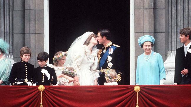 Prince Charles and Princess Diana kiss on the Buckingham Palace balcony. Picture: Getty Images.