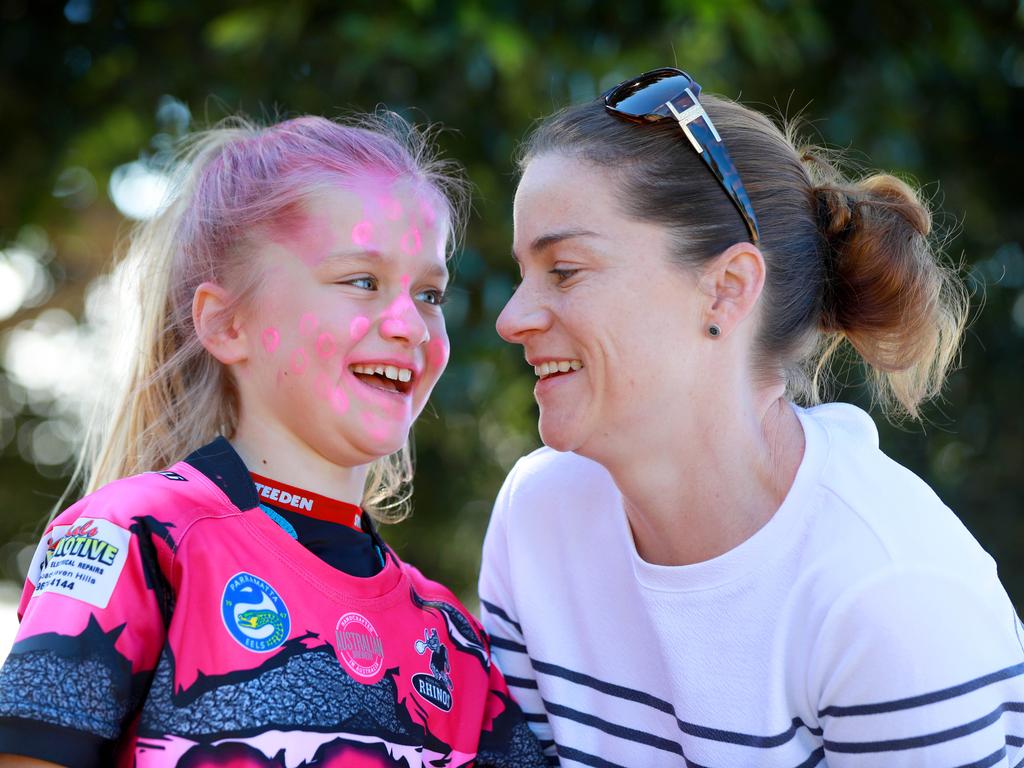 ROUSE HILL TIMES/AAP. 8 year old Samantha Mornhill and her mum Lily Porter pose for photographs at the Rouse Hill Rhinos Pink Day in Kellyville. Kellyville, Saturday 3 August, 2019. Rouse Hill Rhinos JRLC is celebrating its ninth annual Pink Day fundraiser at Wrights Road Reserve. (AAP IMAGE / Angelo Velardo)