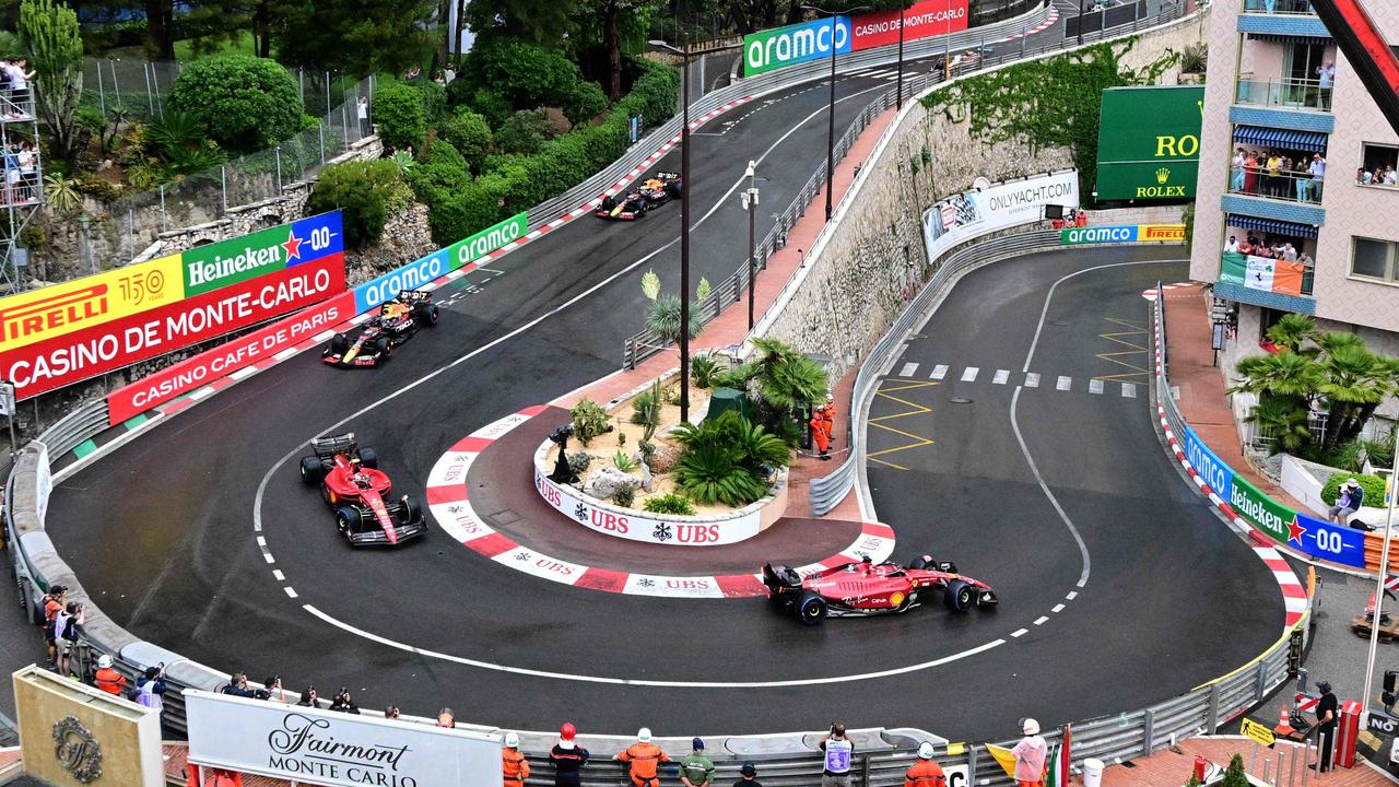 Ferrari's Monegasque driver Charles Leclerc (R), Ferrari's Spanish driver Carlos Sainz Jr (L), Red Bull Racing's Mexican driver Sergio Perez (2L) and Red Bull Racing's Dutch driver Max Verstappen (rear) compete in the Monaco Formula 1 Grand Prix at the Monaco street circuit in Monaco, on May 29, 2022. (Photo by SEBASTIEN BOZON / AFP)