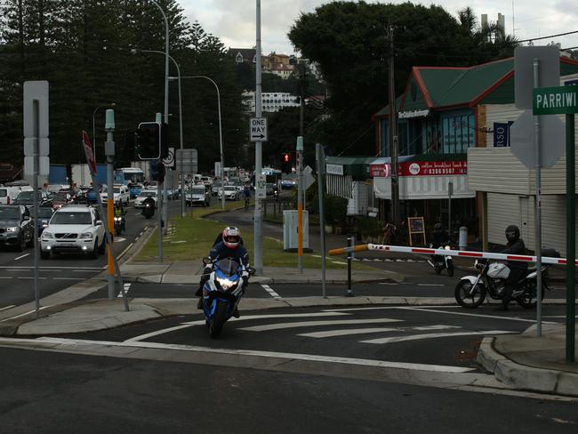 A motorcyclist rides around the first illegal extension on the boom gate in early June. Picture: Annika Enderborg