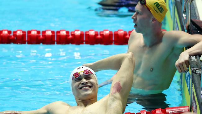 GWANGJU, SOUTH KOREA - JULY 23: Sun Yang (L) of China celebrates as Clyde Lewis of Australia looks on after the Men's 200m Freestyle Final on day three of the Gwangju 2019 FINA World Championships at Nambu International Aquatics Centre on July 23, 2019 in Gwangju, South Korea. (Photo by Catherine Ivill/Getty Images)