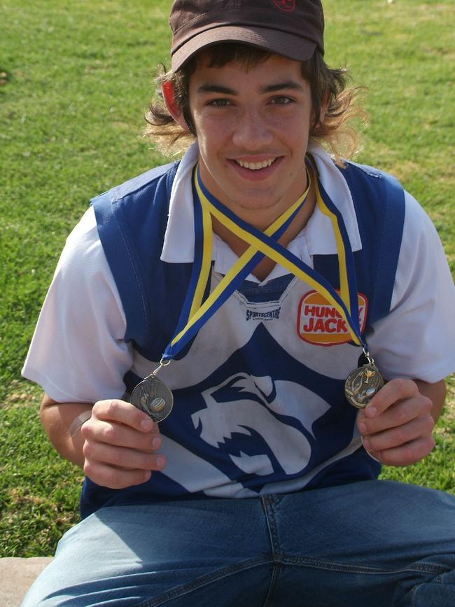 Walker shows off his medals from Broken Hill North’s flag win in 2007. Walker played a stellar role during the match, earning him best-on-ground.