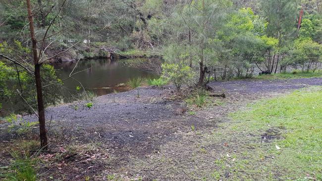 Coal visible on the bank of the Hacking River in 2019. The group is calling for further investigation into the quality of the water before platypus are reintroduced. Picture: Bob Crombie