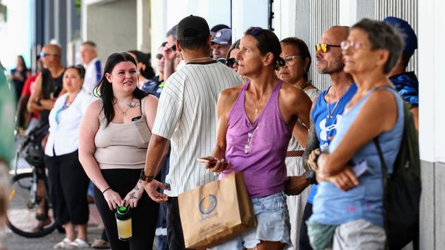 A large crowd gathered to watch the man on the Cairns Central roof, before police set up a Public Safety Declaration Zone around the intersection of Shields and McLeod Street. Picture: Brendan Radke