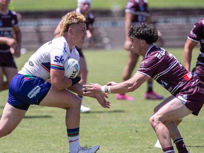 Callum Miskell attempts to tackle Tyson Hansen Picture: Julian Andrews