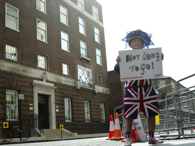 Not long to go ... Terry Hutt with a sign that reads 'Not Long to Go' as he waits with other royal fans for Kate, the Duchess of Cambridge to go into the Lindo wing at St Mary's Hospital to give birth. Pic: AP Photo/Alastair Grant