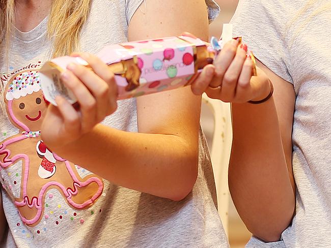 DAILY TELEGRAPH  - 20/12/17Abby Hubble (left) and Javiera Cerda pictured with Xmas bon bons at Peter Alexander store in Sydney CBD.