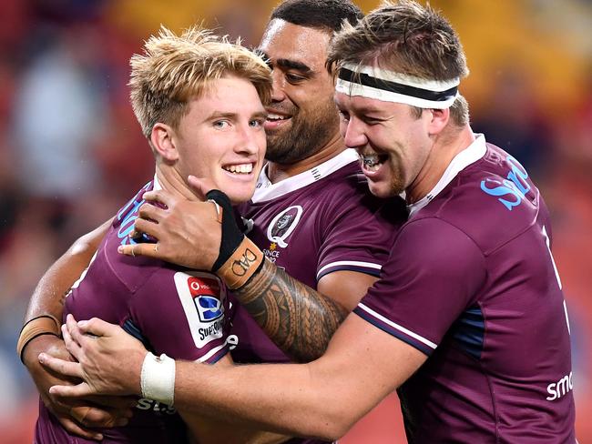 Tate McDermott celebrates with teammates after scoring a try against the Sunwolves at Suncorp Stadium last month.