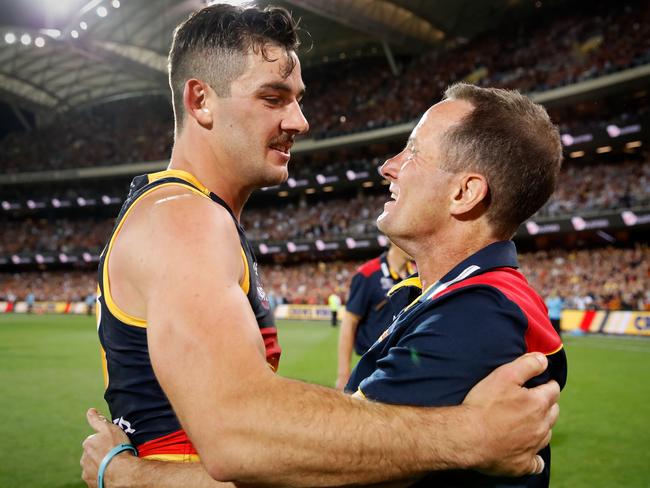 Taylor Walker and Don Pyke. (Photo by Adam Trafford/AFL Media/Getty Images)