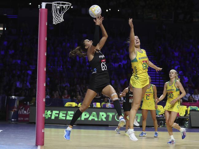 New Zealand's Maria Folau, left, and Australia's Courtney Bruce vie for the ball. Picture: AP Photo/Rui Vieira