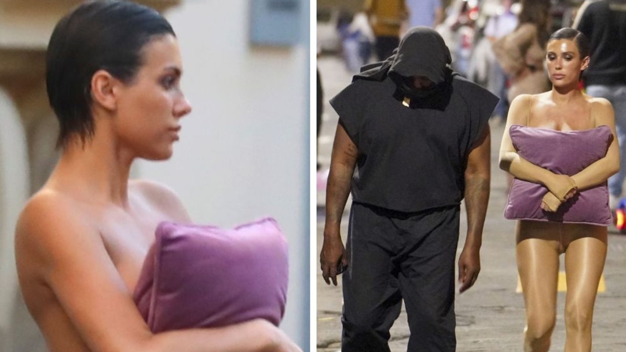 Kanye West’s ‘wife’ Bianca Censori goes topless in Italy with only a cushion covering her breasts.